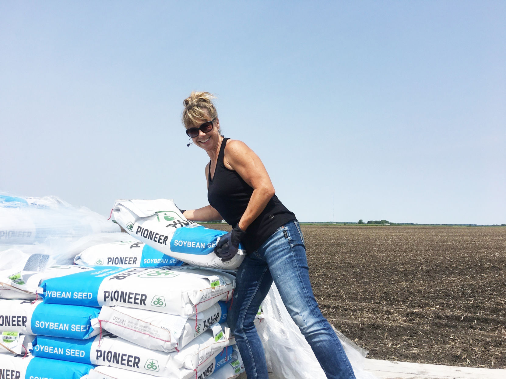 Sarah Ziegler with bags of soybeans.jpg